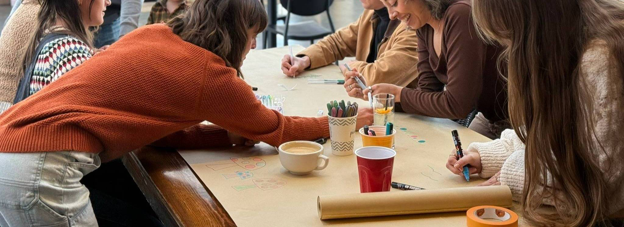 People creating art together at a Pop-Up Art Cafe event in Colorado Springs